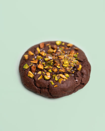 Dubai Chocolate Cookie with a rich, chocolatey exterior, crisp edges, and a soft, fudgy center, filled with crispy Kataifi, creamy Pistachio Butter, and smooth Tahini.