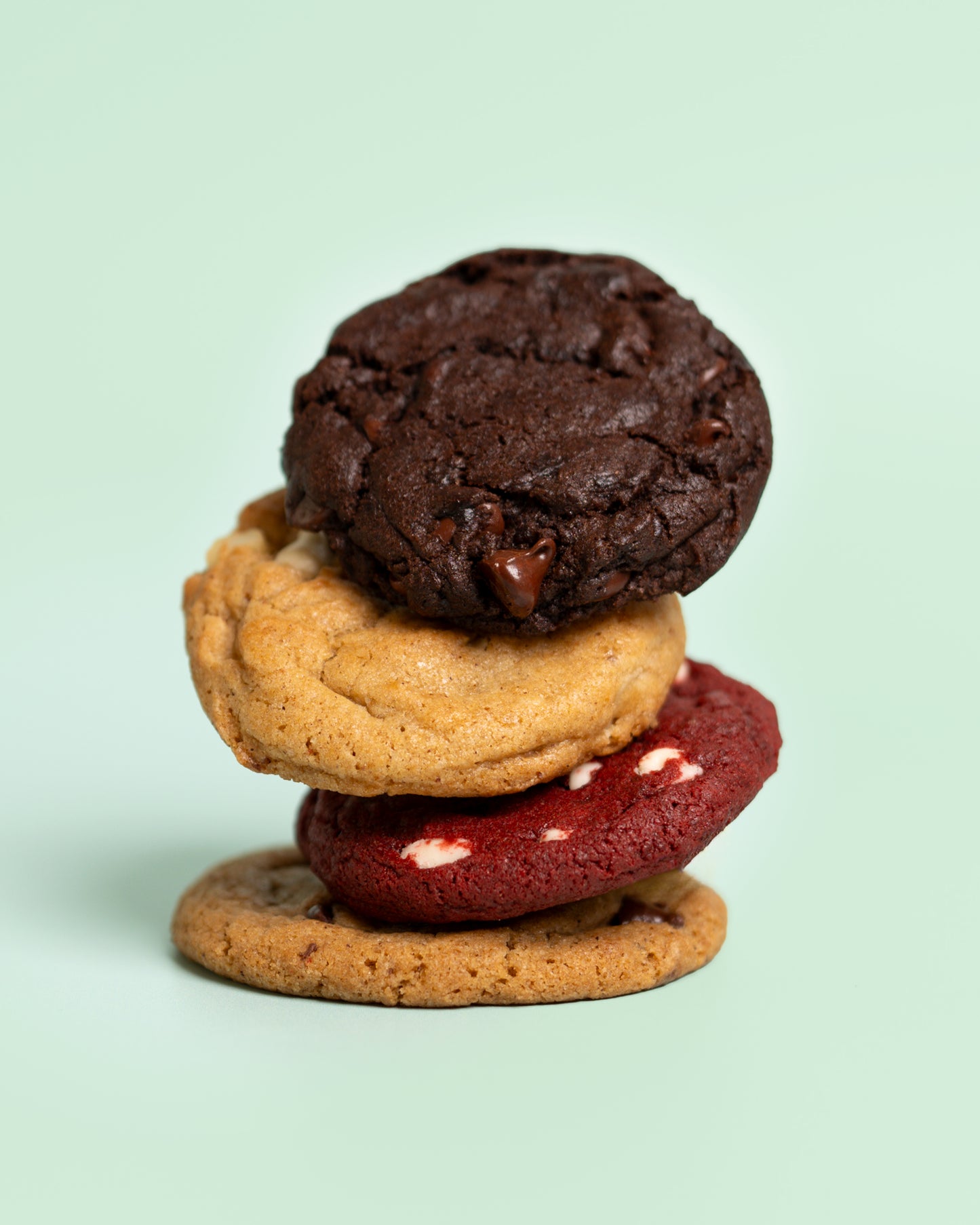 Customizable cookie box featuring 12 freshly baked cookies—choose 4 flavors with 3 cookies each for a personalized sweet treat.