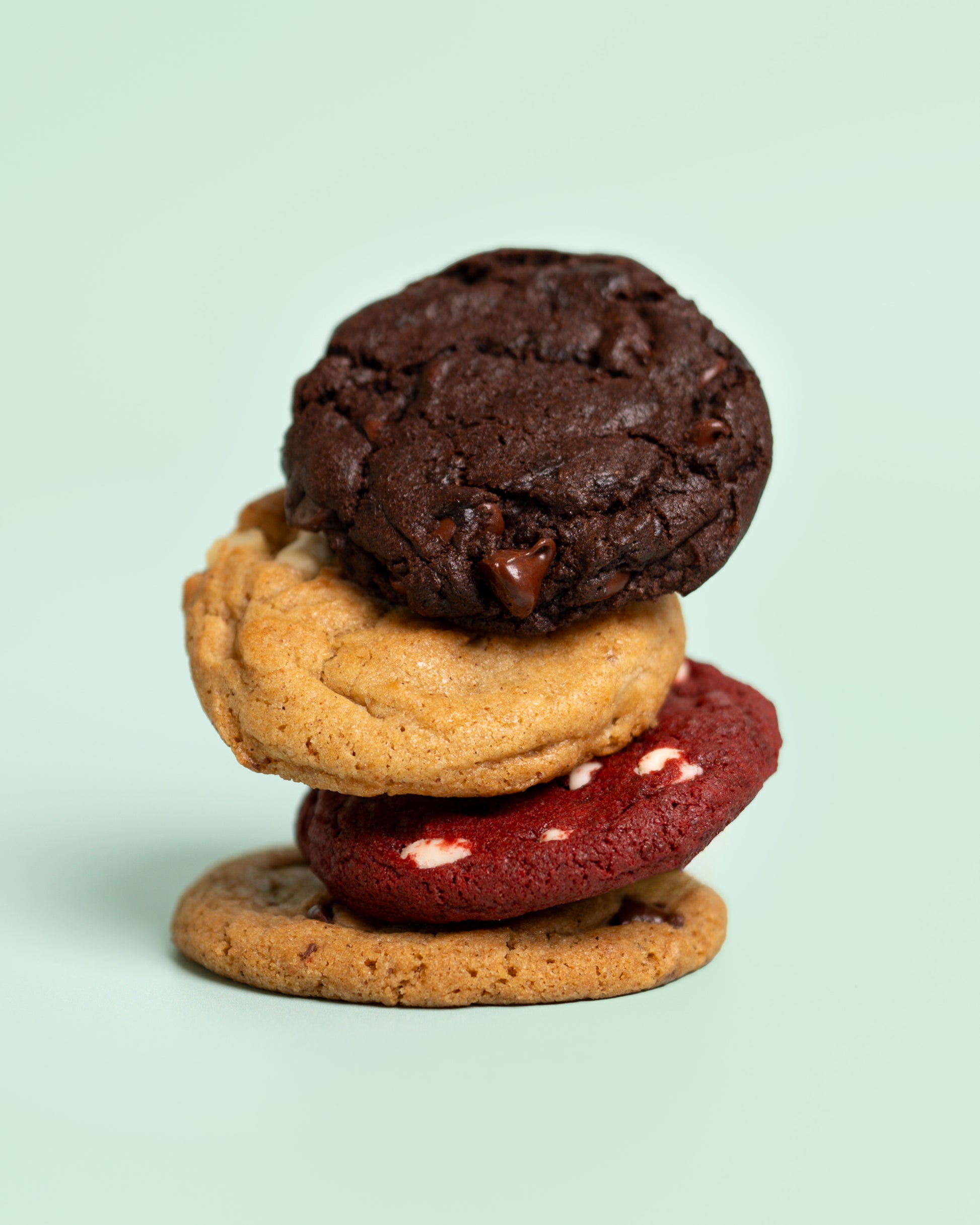 Customizable cookie box featuring 12 freshly baked cookies—choose 4 flavors with 3 cookies each for a personalized sweet treat.